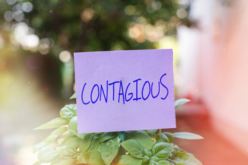 Handwriting text Contagious. Conceptual photo transmissible by direct or indirect contact with...