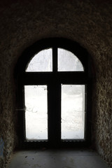 Dusty window of abandoned building