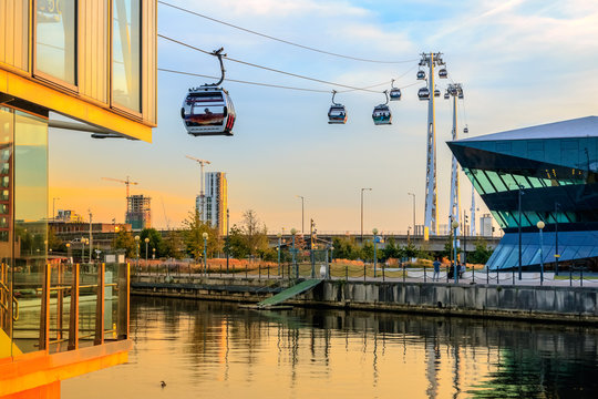 Emirates air line cable car at Royal Victoria Dock in London at sunset
