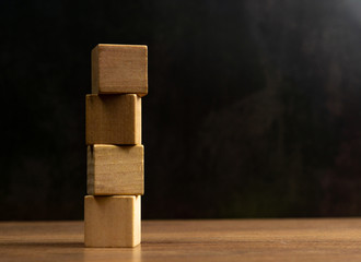 Woodblock on black background, conceptual