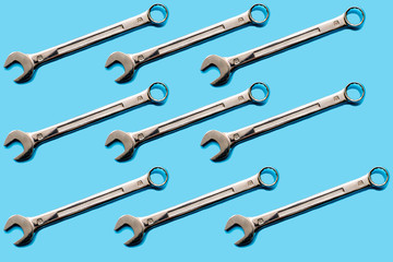 wrenches on a blue background. concept of service. background with hand tools.