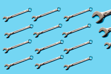 wrenches on a blue background. The concept of selling tools online.