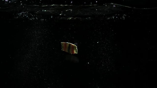 ravioli and gnocci pasta drop in clean water slow motion