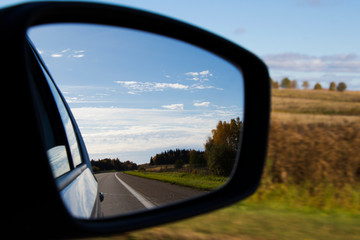 road and car mirror