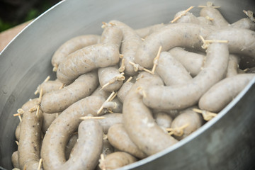 Sausages ready for cooking in a pot