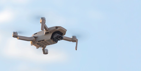 Close-up of flying drone. Space copy