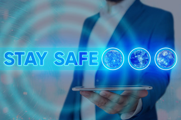 Handwriting text writing Stay Safe. Conceptual photo secure from threat of danger, harm or place to keep articles Elements of this image furnished by NASA
