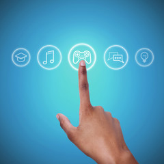 Intelligent computing. Black guy picking one of functional icons on virtual user interface, blue background. Collage