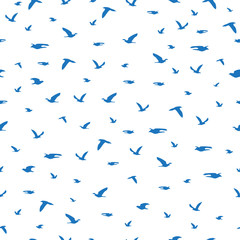 Seamless pattern flock of blue birds silhouette flying on white, vector eps 10