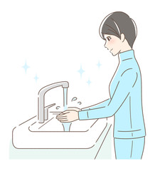 水道水で手を洗う女性