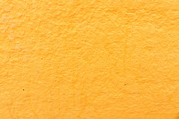 Orange rough stucco on the wall