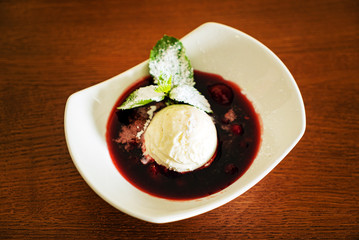 vanilla ice cream with berry sauce