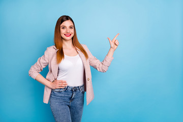 Portrait of positive cheerful girl promoter point index finger copyspace present adverts promo...