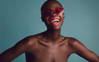 Cheerful black female model with buzz cut hairstyle