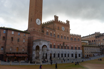 View of the famous " Piazza del Campo" ( Square of Campo) and "Palazzo Pubblico" ( Public Palace) in the city of Siena, Tuscany, Italy
