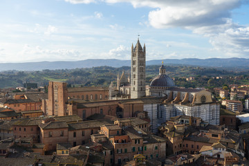 Fototapeta na wymiar View of the Duomo and the city of Siena from the top of the tower of Mangia, Tuscany, Italy