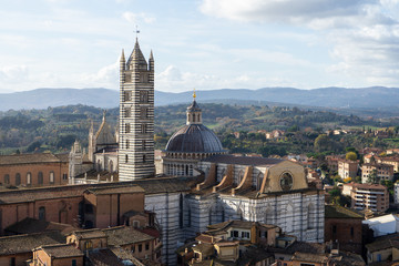 View of the Duomo and the city of Siena from the top of the tower of Mangia, Tuscany, Italy
