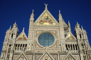 View of the facade of the magnificent Duomo in the city of Siena, Tuscany, Italy