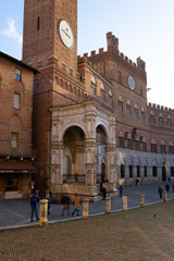 View of the famous " Piazza del Campo" ( Square of Campo) and "Palazzo Pubblico" ( Public Palace) in the city of Siena, Tuscany, Italy