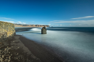 Dyrholaey cape, volcanic black sand beach in South Iceland