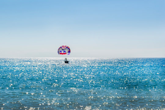 skydiver on the horizon of the sea