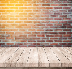 Old wood table with abstract old brick wall background for product display
