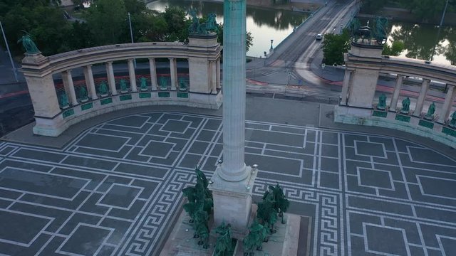 Drone footage of the empty Heroe's Square in Budapest, Hungary at the time of the Covid virus. Early morning at the sunrise in spring.