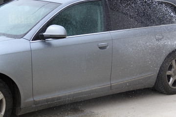 Cleaning car using high pressure water. outdoor.