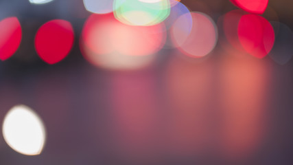 Night traffic light bokeh on road