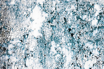 Old rusty metal texture with cracked blue paint. Grunge cracked background