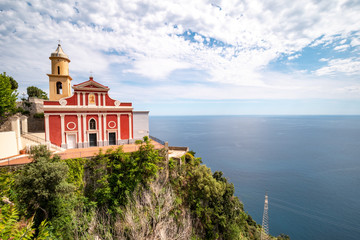Fototapeta na wymiar Apostolic Church of San Giovanni Battista (Baptist) overlooking the sea of the Amalfi coast. Conca dei Marini, Salerno, Campania, Italy