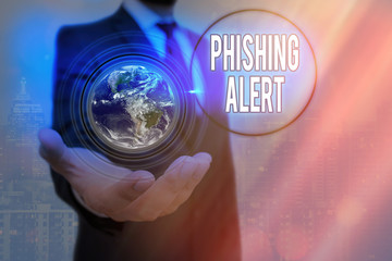 Writing note showing Phishing Alert. Business concept for aware to fraudulent attempt to obtain...