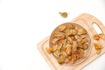 orange physalis berries on a white background