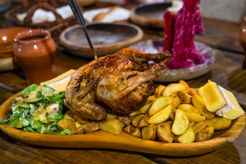 chicken meal in medieval tavern, Hungary