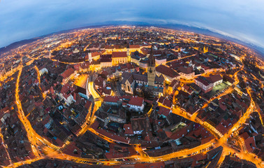 Wide panorama of Sibiu city, city center of Sibiu at evening twilight time