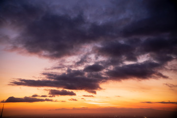 Naklejka na ściany i meble Colorful dawn / dusk sky with dark clouds