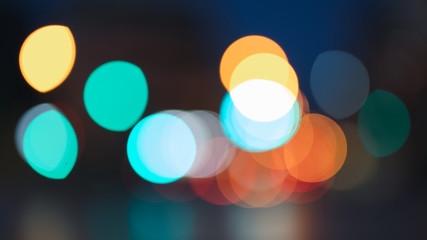 Night traffic light bokeh on road