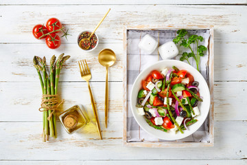Salad of asparagus, tomato, cucumbers, feta cheese
