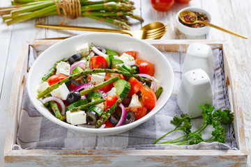 Greek salad of asparagus, feta, chopped tomatoes