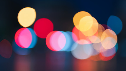 Night traffic light bokeh on road