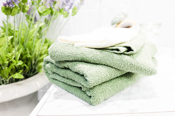 Obraz na płótnie Canvas Fresh clean bath towels in bathroom