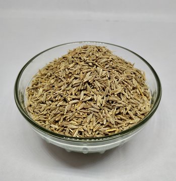 Common Cumin Or Zeera In A Glass Bowl On White background Stock Photo