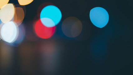 Night traffic light bokeh on road
