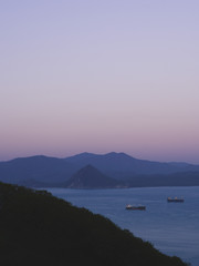 Sister mountain and the bay Nakhodka. Primorsky kray, Russia. Ships in the roadstead.