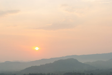 Sunset scene with silhouette mountain at Khun Dan Prakan Chon Dam	