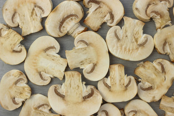 Cut Mushrooms spread out on a gray background, background, texture, pattern