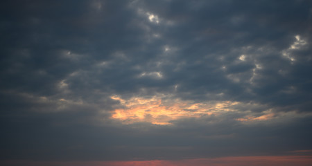 Colorful dramatic sky with stormy cloud on sunset