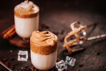 Still life of creamy corean dalgona coffee with coffee beans