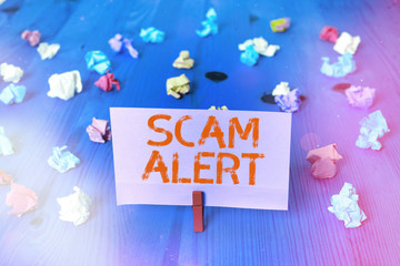 Handwriting text Scam Alert. Conceptual photo unsolicited email that claims the prospect of a...