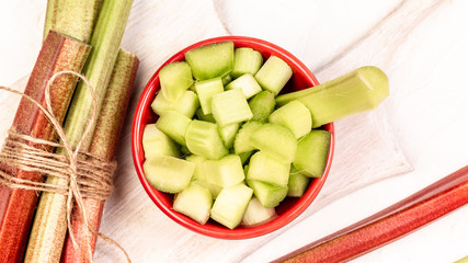 Rhubarb - cooking fresh rhubarb. fresh organic rhubarb in bowl, selective focus